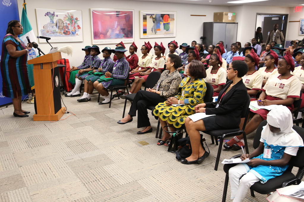 Former Spokeswoman of the United States Embassy, Dr Atim George (left) delivering a lecture to teenage students to mark the International Year of the Girl Child.