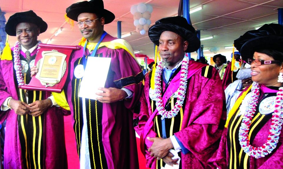 Prof Mahmood Yakubu  (middle) after being conferred with a fellowship award by the Lagos State Polytechnic at the institution’s convocation ceremony. 
